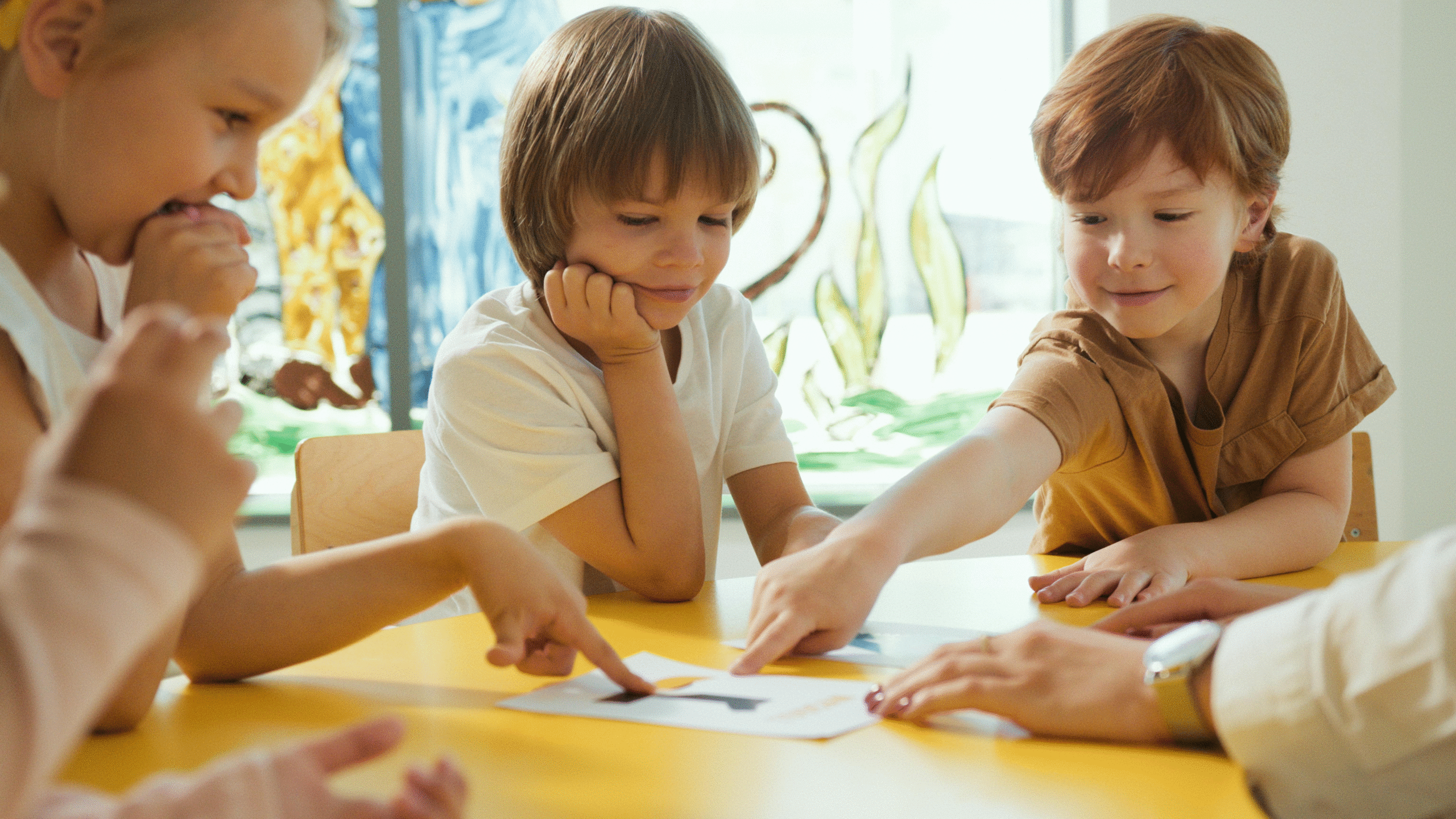 Kids looking a paper together